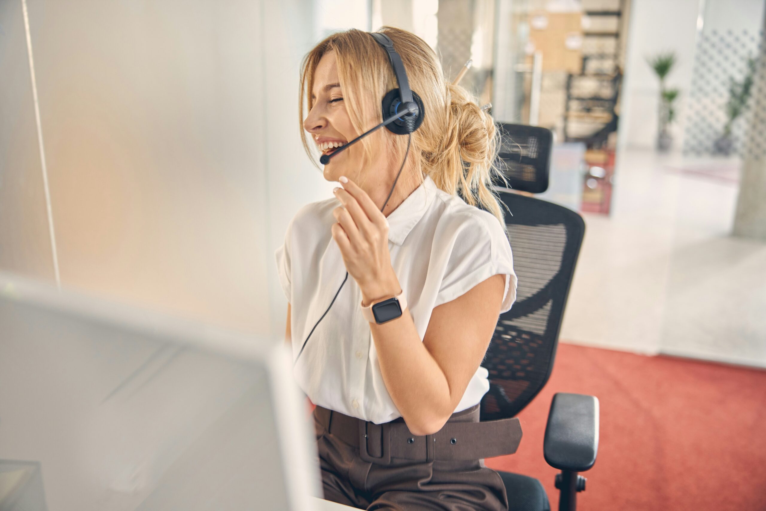 call center agent laughing on the phone